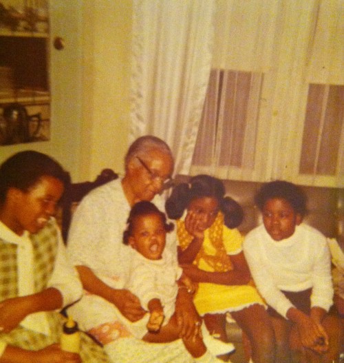 Right to left:  Cheryl; her cousin, Karen; Cheryl's grandmother holding younger sister Eileen; and older sister Adriane.